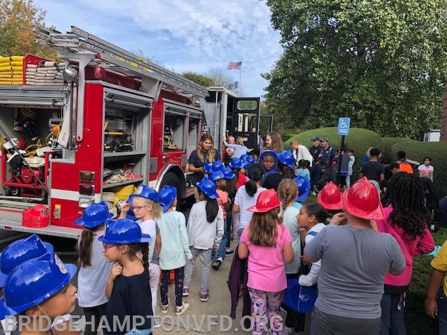 Next everyone headed outside to check out the Fire Engine, and learn about all the ladders and hoses, and equipment on it....