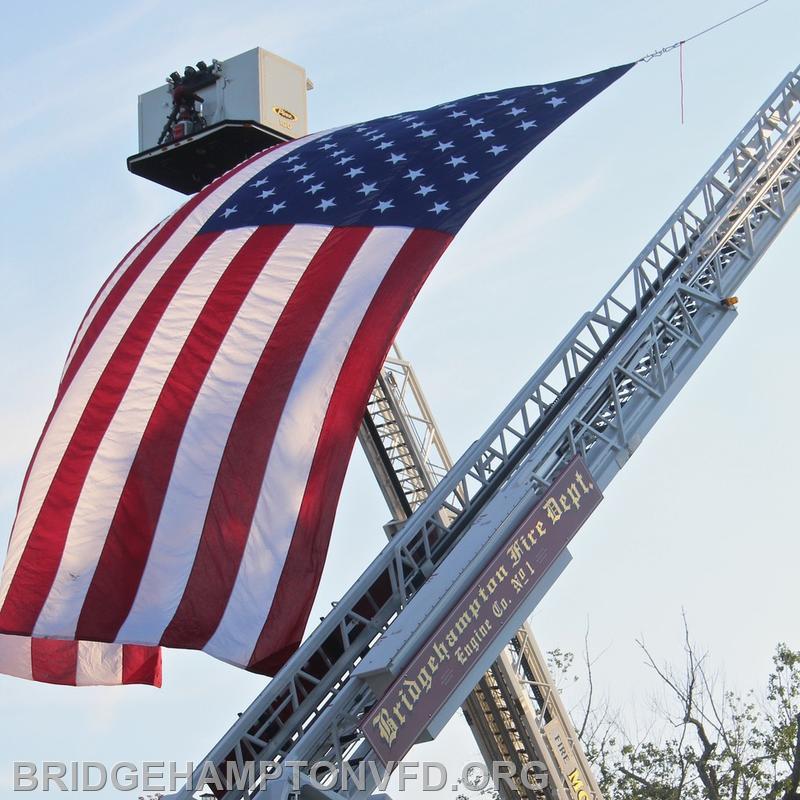 Bridgehampton Fire Department helps to craft the Flag Arch for the service. 